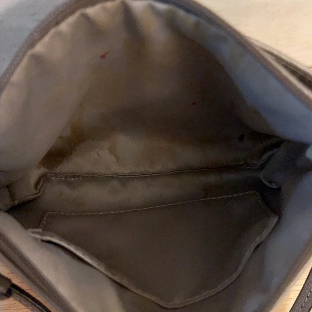 Coach metallic leather wristlet clutch purse.